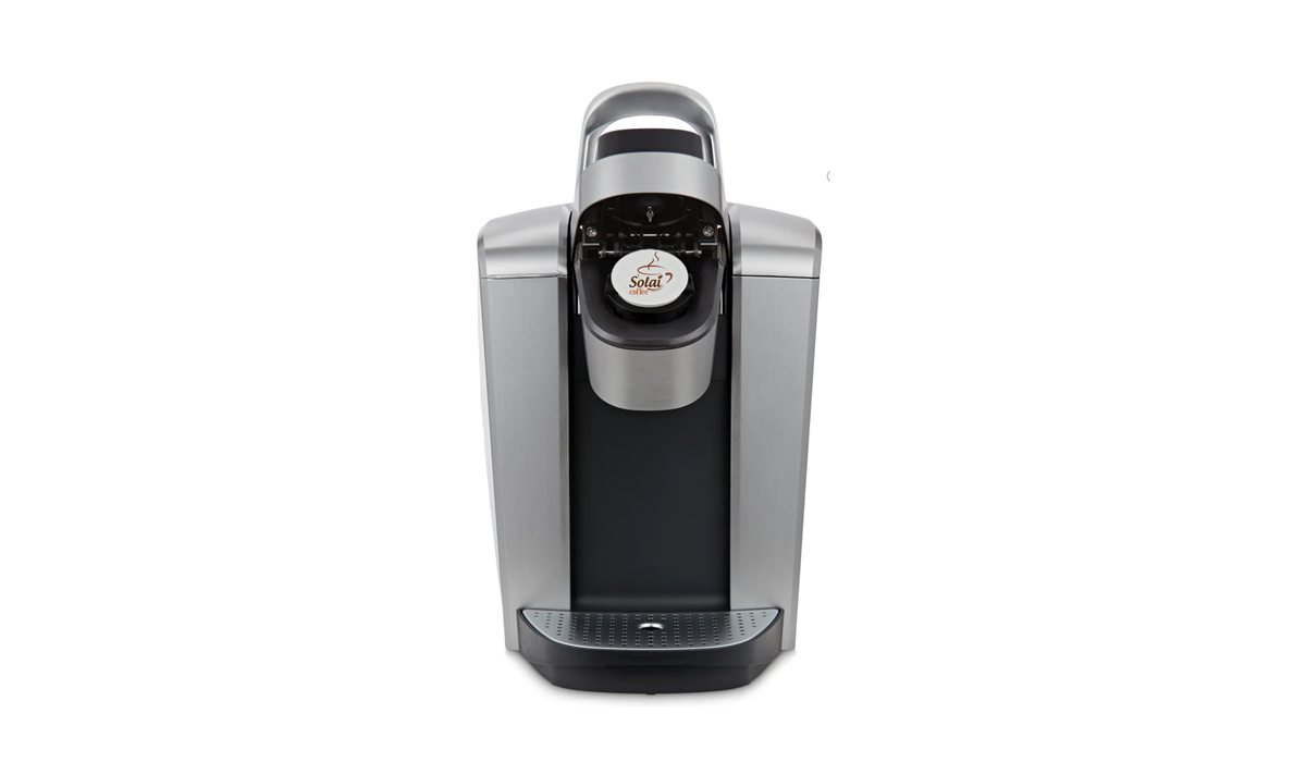 Keurig coffee maker with Solai coffee K-pod inserted, ready to brew a fresh cup of coffee.