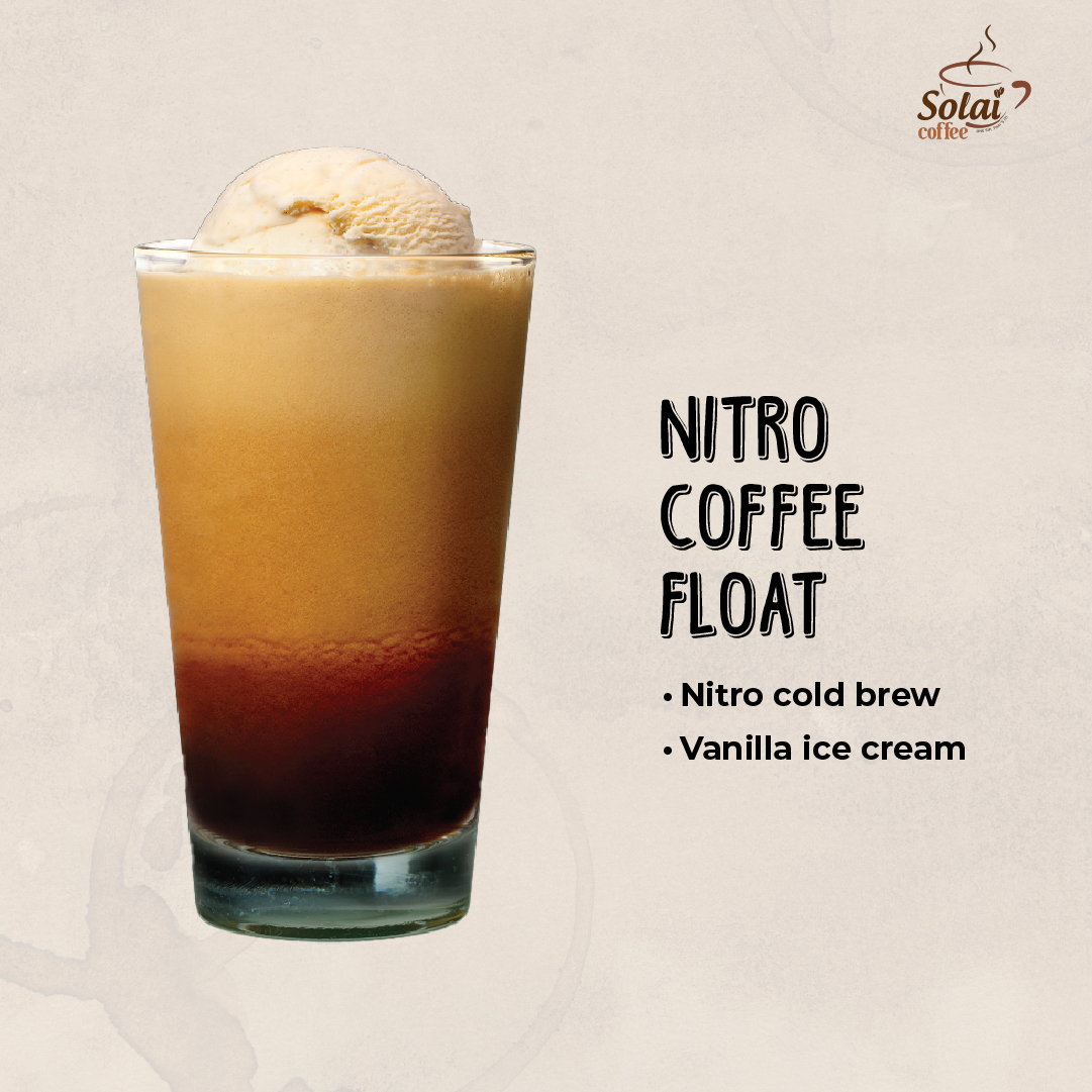 A tall glass filled with Nitro Coffee Float, showcasing cascading nitrogen-infused cold brew coffee topped with a scoop of vanilla ice cream, creating a creamy and frothy summer coffee treat.