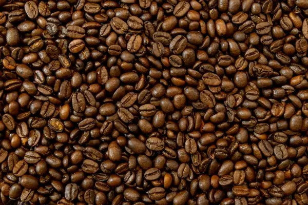 Medium roast coffee beans with a balanced brown color, offering a perfect blend of acidity, sweetness, and bitterness.
