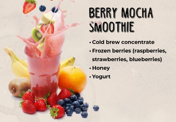 Colorful glass of berry mocha smoothie surrounded by tropical fruits, depicting a refreshing summer drink.