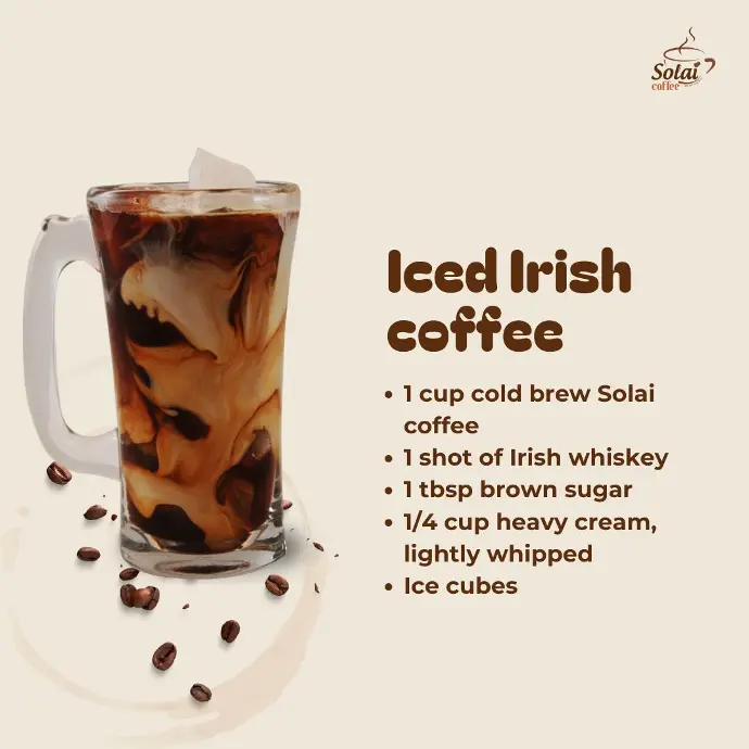 Iced Irish Coffee A chilled glass of iced Irish coffee with layers of coffee, whiskey, cream, and coffee beans on the surface.