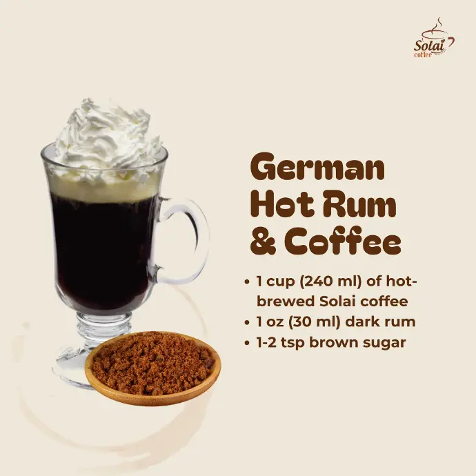 German Hot Rum and Coffee A glass of German hot rum and coffee, with whipped cream piled on top and a cinnamon poweder on the side for garnish.