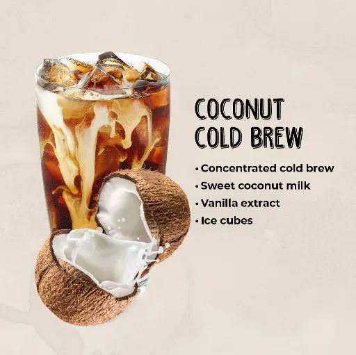 Coconut Cold Brew A refreshing glass of coconut cold brew with coconut milk swirling through the coffee, served over ice.