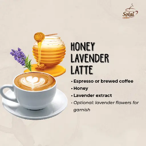 Honey Lavender Latte A calming honey lavender latte in a ceramic mug, with a drizzle of honey and a sprig of lavender resting on the foam.
