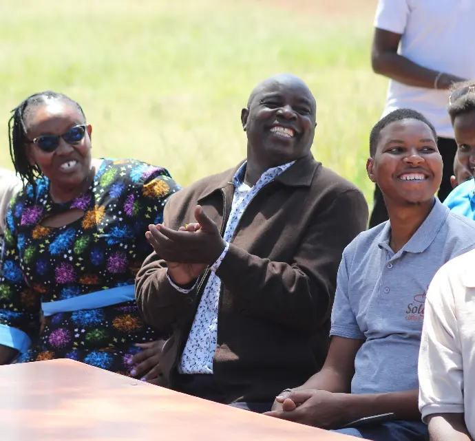 From left, Jeniffer, deputy head teacher, Mr. Kinyanjui, the Headteacher and Peter CEO Solai Coffee