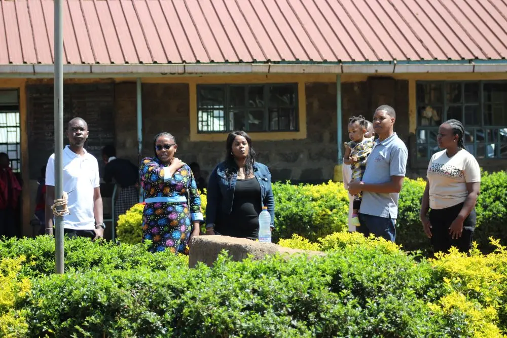The deputy headteacher leads the Solai Coffee team through the school compound, pointing out different areas and providing background information. Activity 2