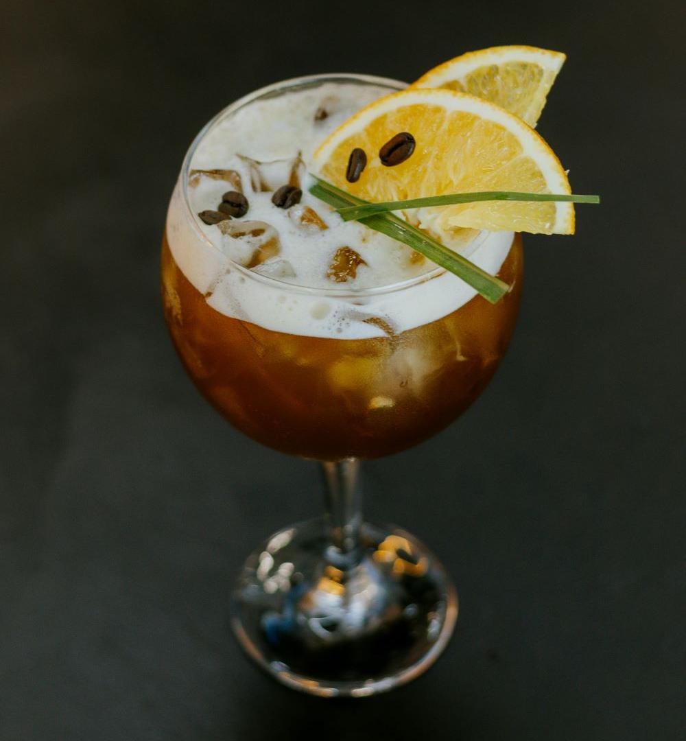 A refreshing tall glass of Coffee Lemonade – Mazagran, offering a perfect balance of coffee and citrus for a cool, tonic beverage.