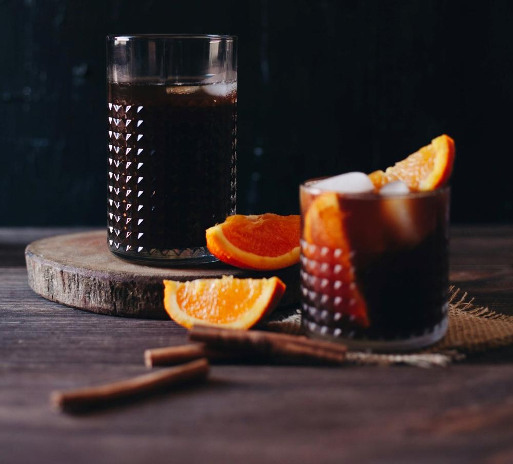 A vibrant glass of Orange Espresso, blending bold espresso with fresh citrus for a refreshing and unique coffee experience.