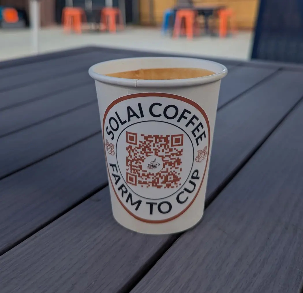 A steaming cup of coffee brewed from a distinctive blend of beans sourced from multiple Kenyan regions, showcasing the country’s diverse flavor profiles.