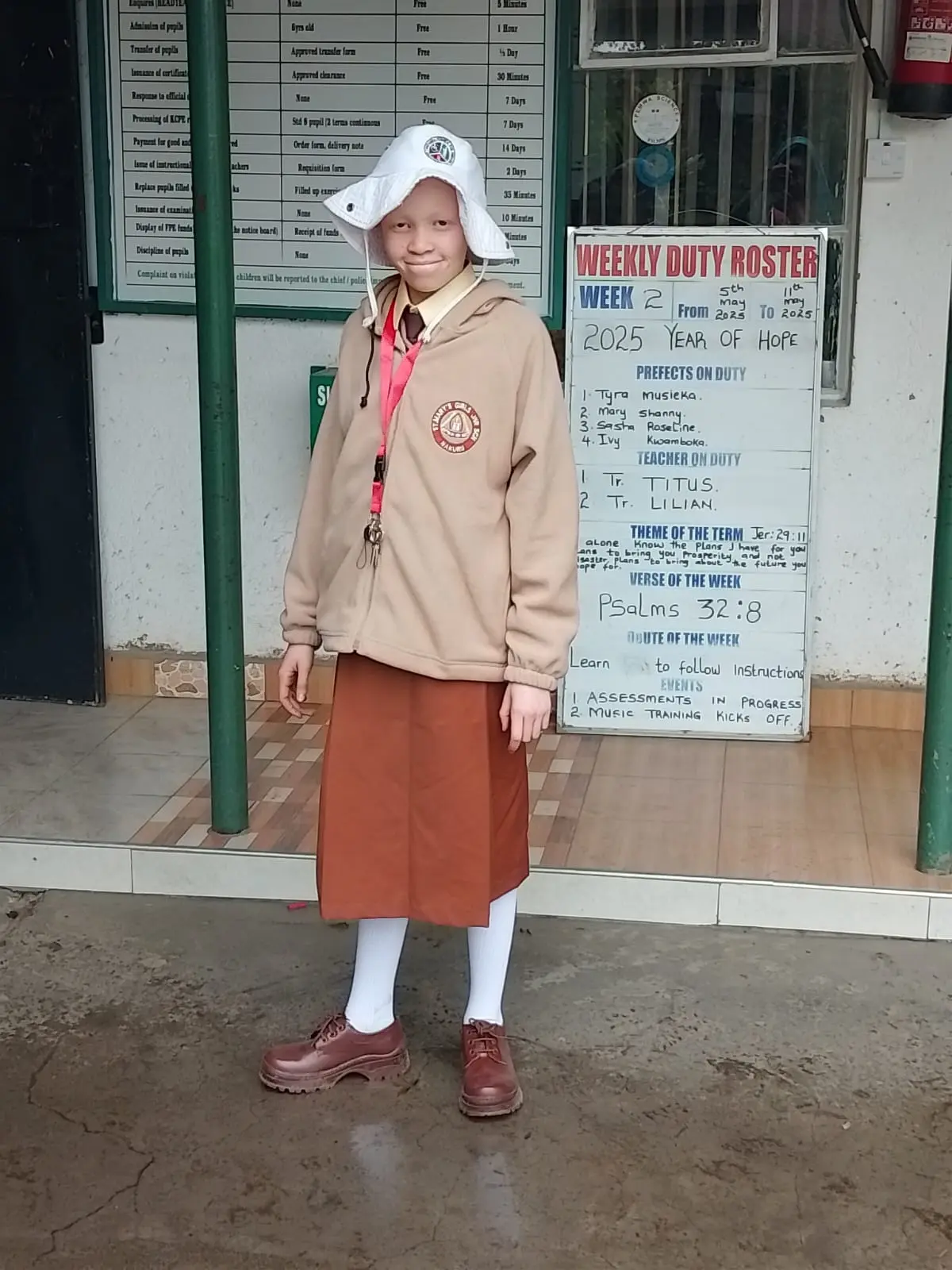 Jane Nduta, one of the students supported through Solai Coffee’s Nyakinyua initiative, smiles at her new school, St. Mary’s Catholic Boarding School. Her journey symbolizes hope and access to quality education for every child.