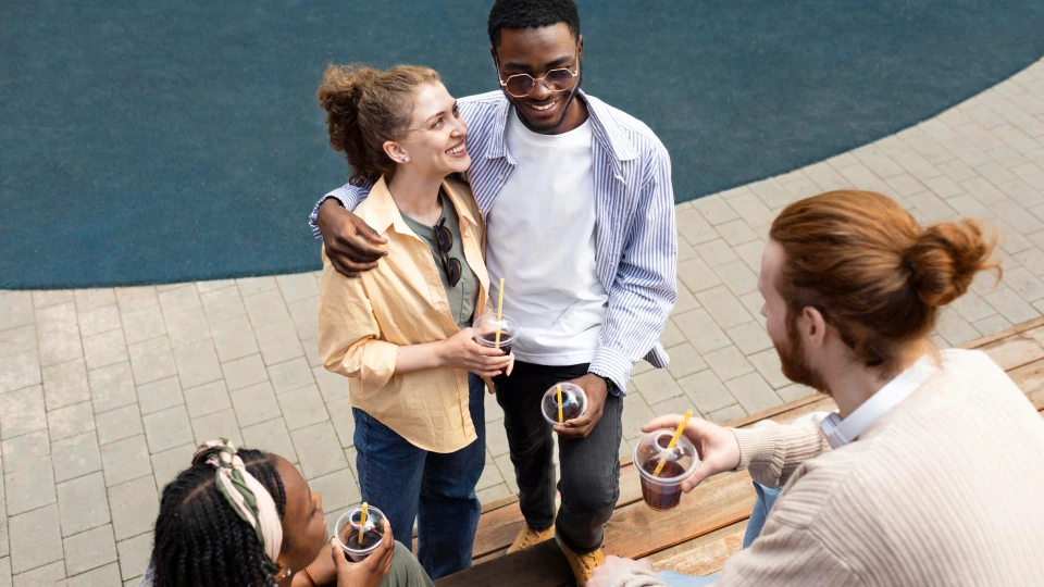 People enjoying iced coffee during warm summer weather