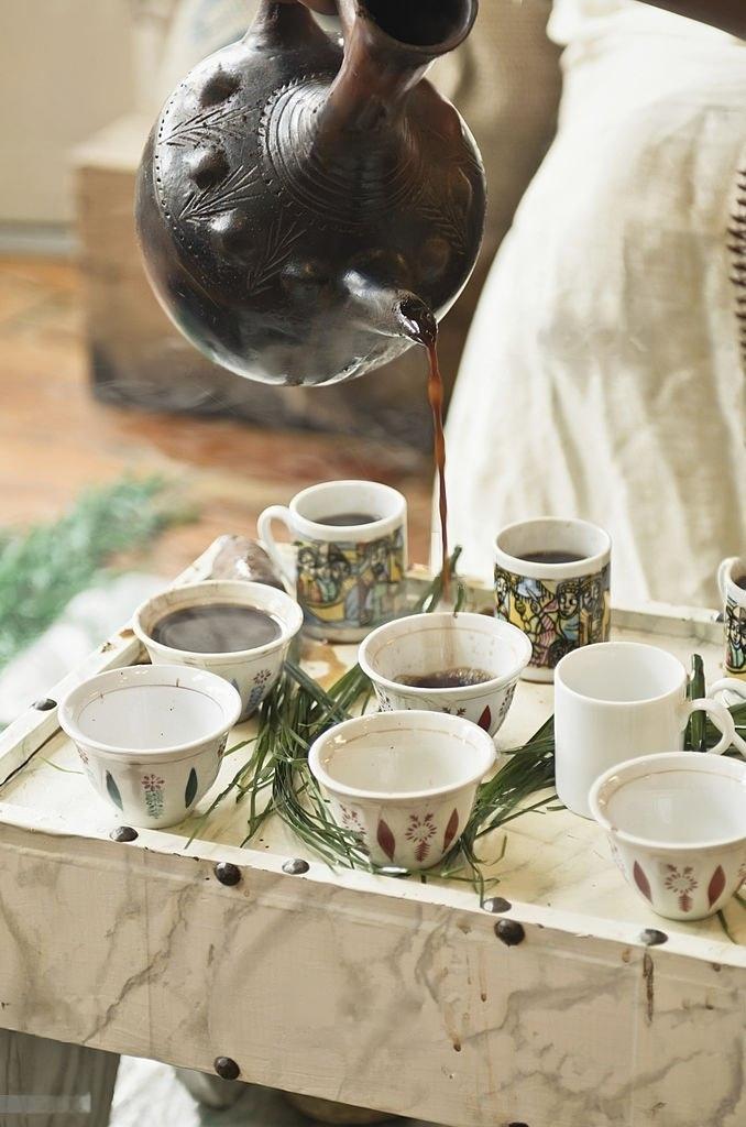 fresh Brewed coffee poured from Buna pot fresh brewed coffee poured from Buna pot for Ethiopia cultural coffee ceremony