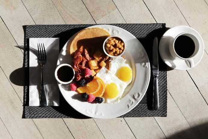 A balanced western breakfast diet pairing with coffee drink.